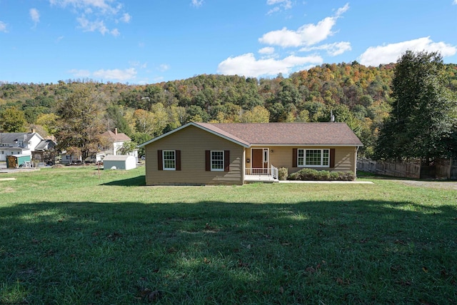 single story home featuring a front yard and a porch