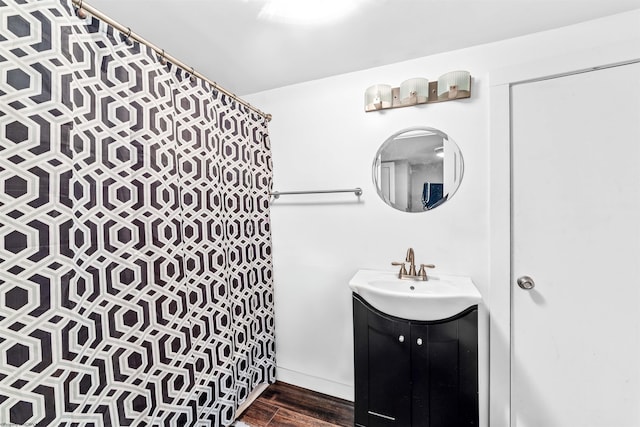 bathroom featuring vanity and hardwood / wood-style flooring