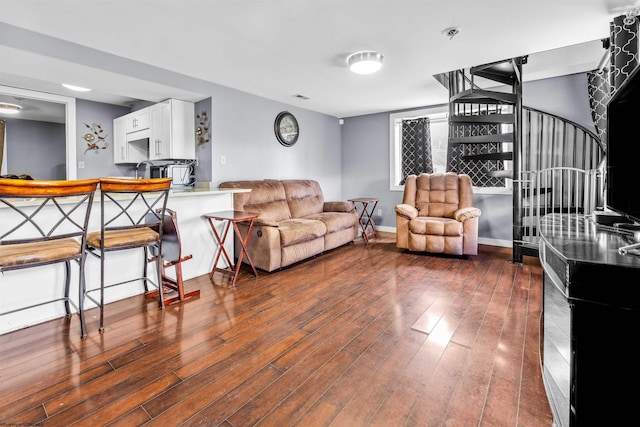 living room with sink and dark hardwood / wood-style floors