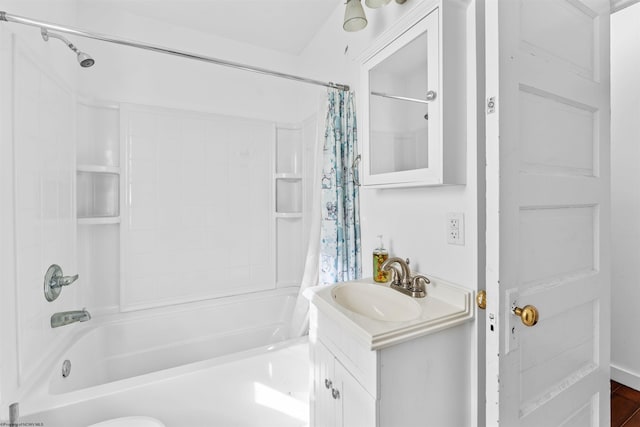 bathroom featuring shower / tub combo with curtain and vanity