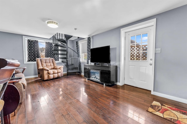 living room with dark hardwood / wood-style floors