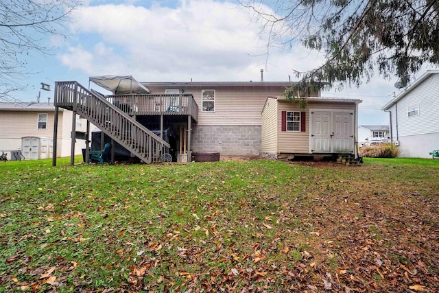 back of house with a lawn and a deck