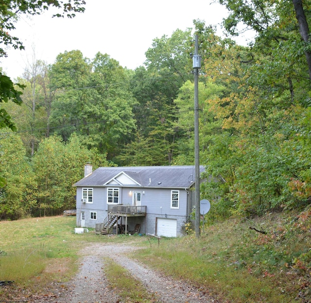 view of front of house featuring a wooden deck and a garage