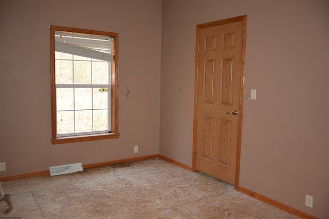 empty room with lofted ceiling