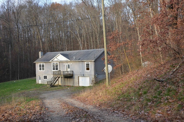 view of front of house featuring a wooden deck