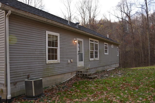 view of side of property with central AC