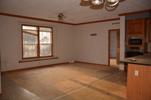 interior space with ceiling fan and crown molding