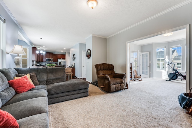 living room featuring crown molding, a textured ceiling, and carpet