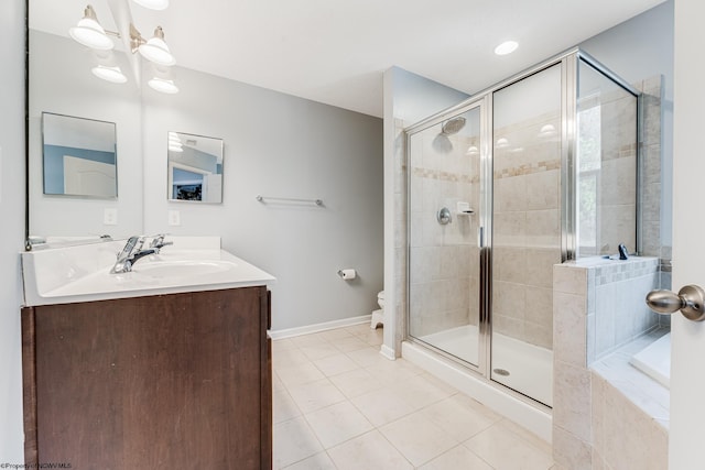 full bathroom featuring tile patterned floors, toilet, independent shower and bath, and vanity