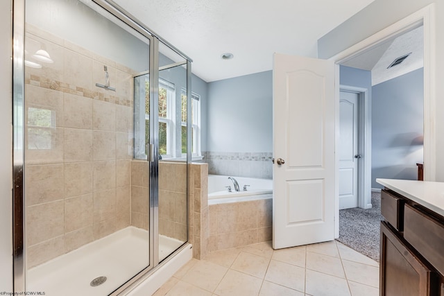 bathroom with vanity, tile patterned floors, and independent shower and bath