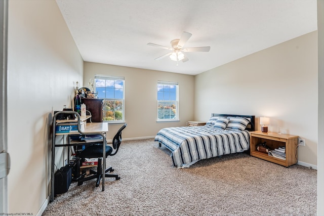 bedroom featuring ceiling fan and carpet