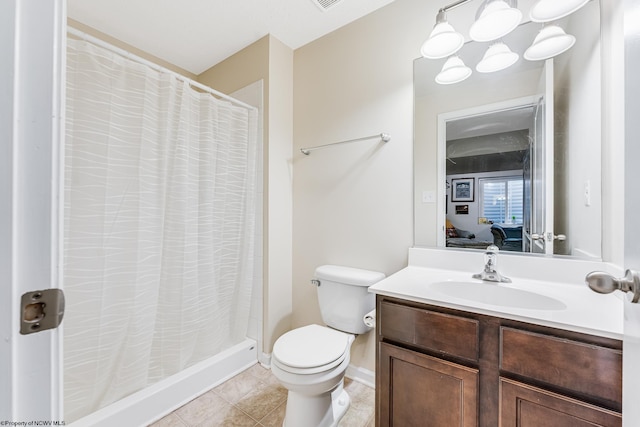 bathroom with tile patterned flooring, vanity, toilet, and a shower with curtain