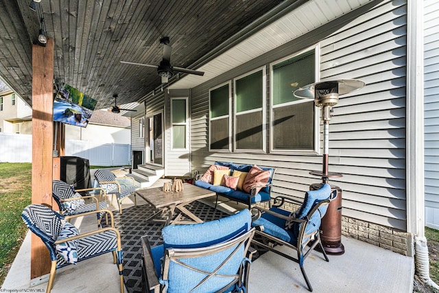 view of patio / terrace with an outdoor living space and ceiling fan