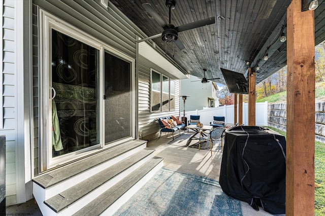 view of patio with ceiling fan, a grill, and an outdoor living space