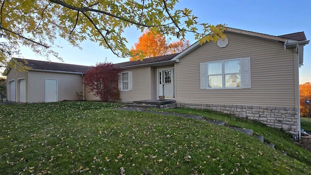 rear view of house featuring a lawn