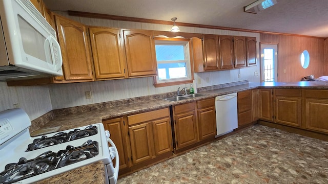 kitchen featuring a textured ceiling, crown molding, sink, and white appliances