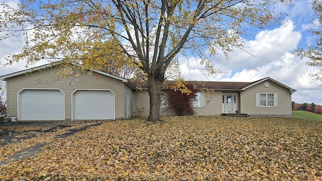 ranch-style house featuring a garage