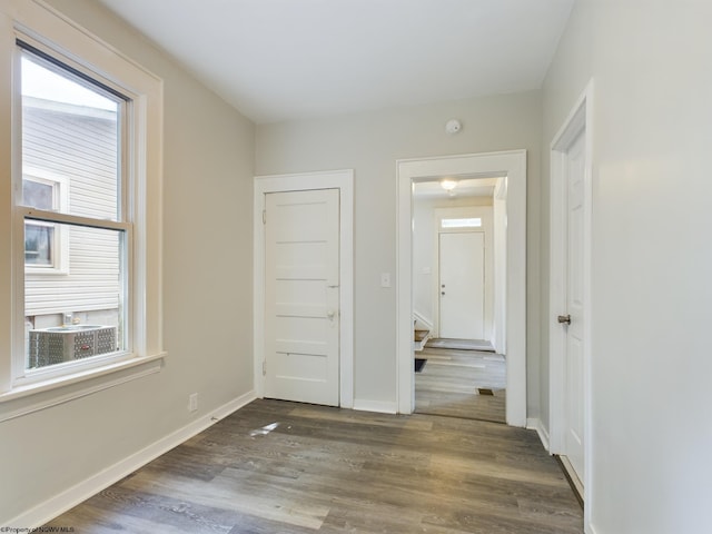 interior space with dark hardwood / wood-style flooring and a closet