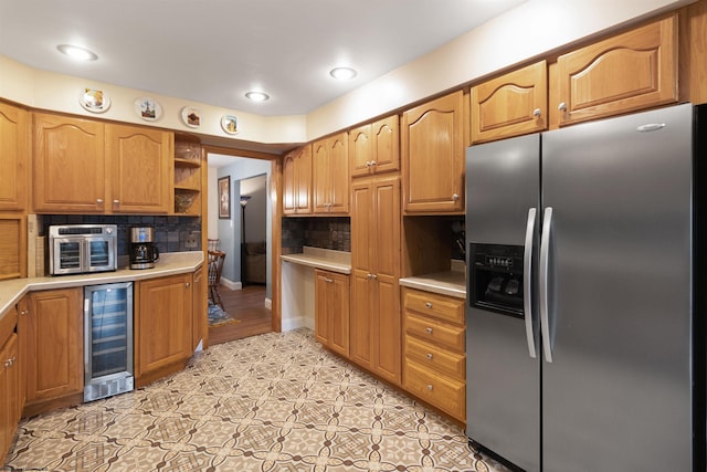 kitchen featuring stainless steel refrigerator with ice dispenser, backsplash, wine cooler, and light tile patterned floors