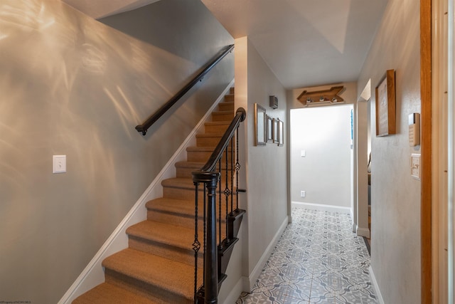 staircase with tile patterned flooring