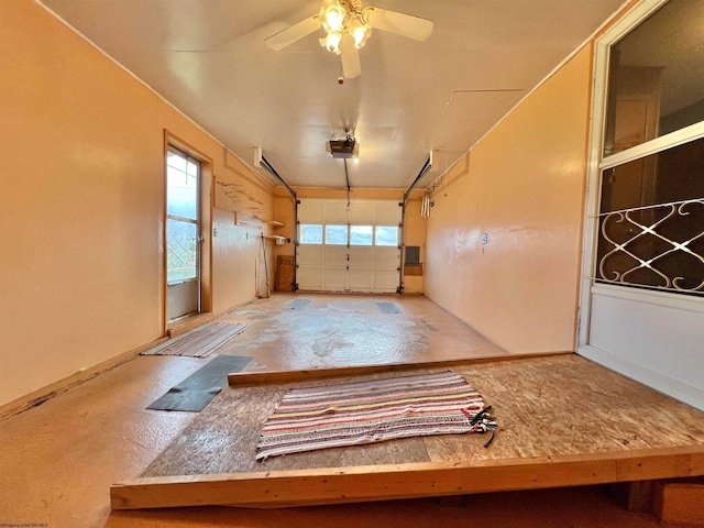 garage featuring a garage door opener and ceiling fan