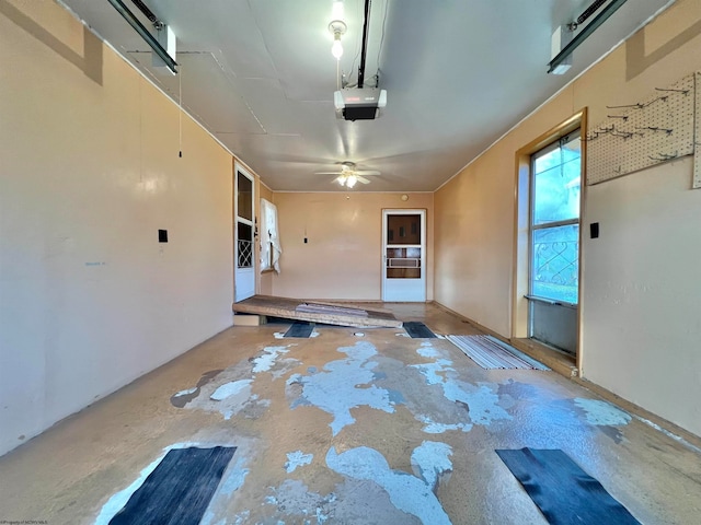 interior space featuring ceiling fan and concrete floors