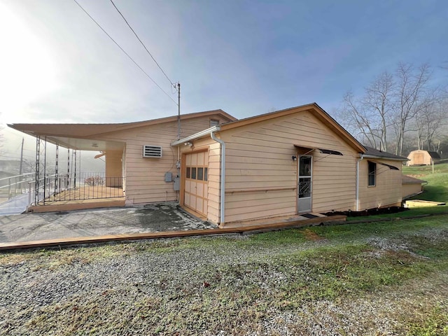 rear view of house with a garage