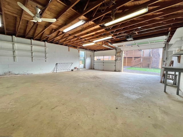 garage featuring ceiling fan and a garage door opener