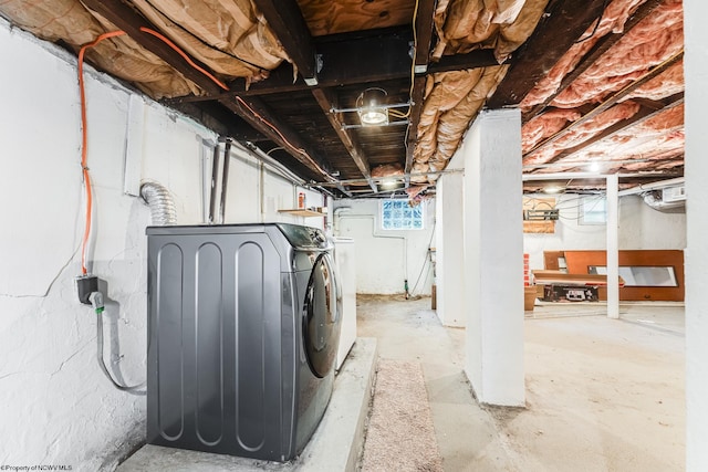 clothes washing area with washer and dryer