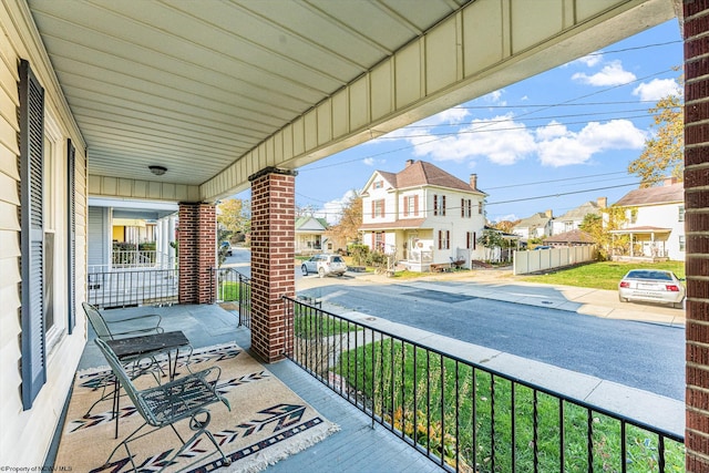 balcony featuring a porch