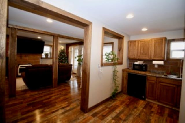 kitchen with dark hardwood / wood-style flooring