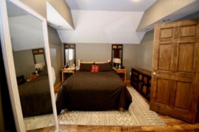 bedroom featuring vaulted ceiling