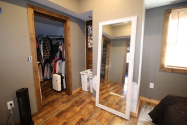 hallway featuring wood-type flooring