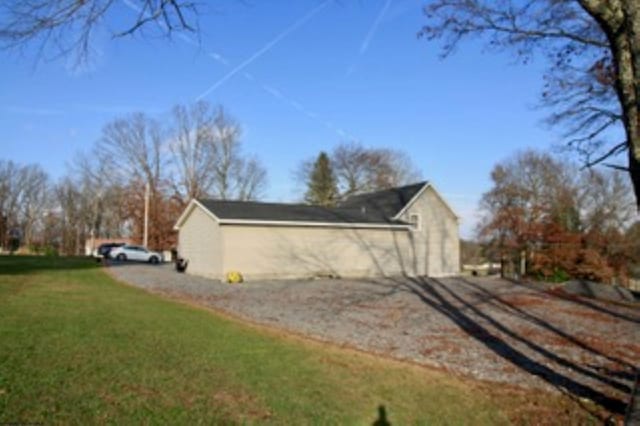 view of home's exterior with a yard