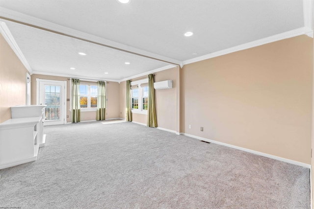 unfurnished living room featuring a textured ceiling, light colored carpet, a wall unit AC, and ornamental molding