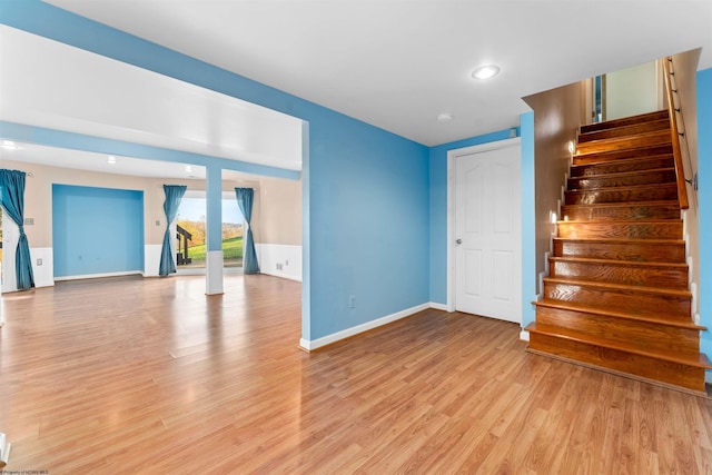 unfurnished living room with light hardwood / wood-style flooring