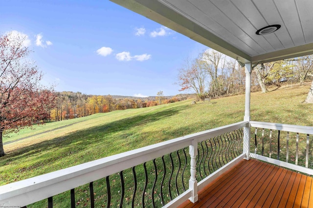 wooden deck with a porch and a yard