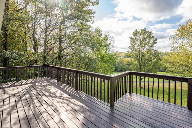 wooden deck with a yard