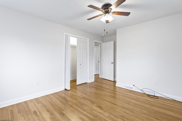 unfurnished bedroom with ceiling fan and light hardwood / wood-style flooring