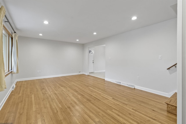 unfurnished room with light hardwood / wood-style flooring