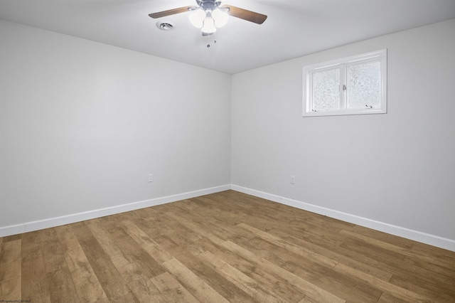 spare room featuring ceiling fan and hardwood / wood-style floors