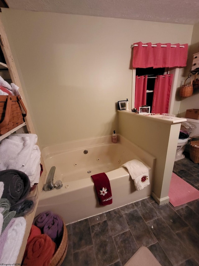 bathroom with a bathing tub and toilet