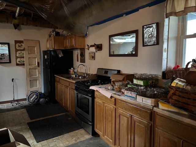 kitchen with sink and black appliances