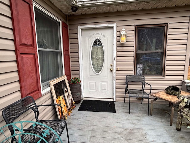 entrance to property with a wooden deck