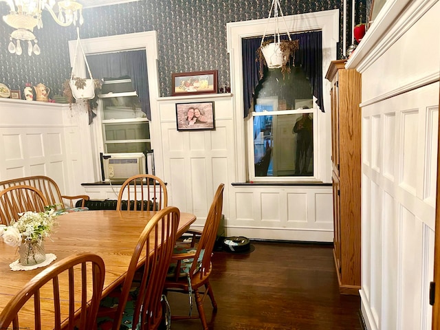 dining room featuring cooling unit, a chandelier, and dark hardwood / wood-style floors