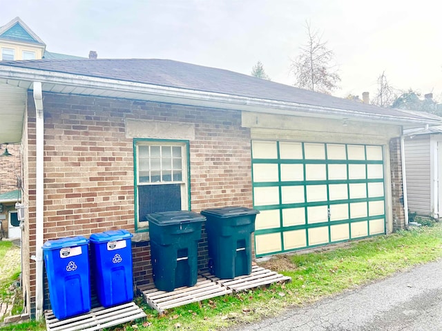 view of side of property with a garage