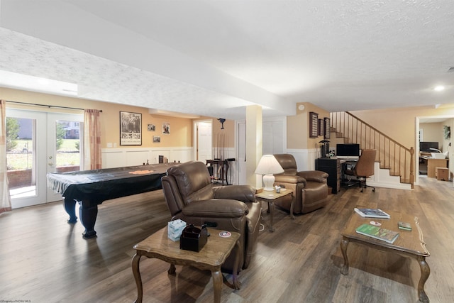 rec room with french doors, hardwood / wood-style floors, a textured ceiling, and pool table