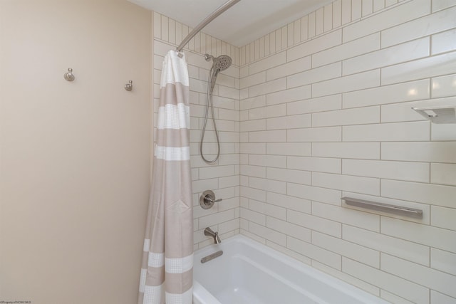 bathroom featuring shower / bathtub combination with curtain