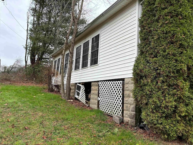 view of home's exterior with a yard