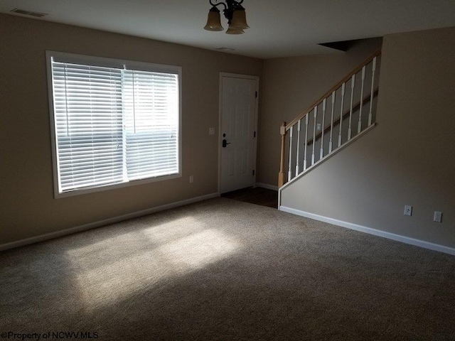 foyer featuring carpet floors